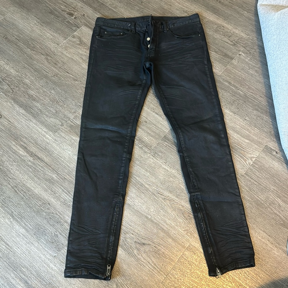 Black jeans with zippers on bottom